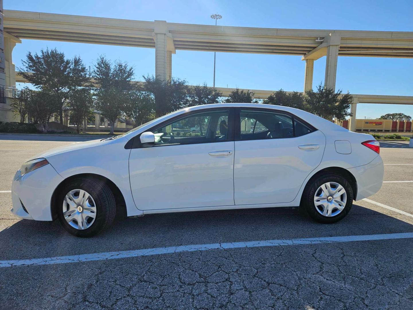 2014 white Toyota Corolla (5YFBURHE7EP) , located at 5005 Telephone Rd., Houston, TX, 77087, (713) 641-0980, 29.690666, -95.298683 - Photo#1